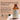 An amber glass bottle of Medhi Invictus Essential Hair Revival Oil on a beige background with promotional text and ingredient badges. The bottle has a cream label and is shown alongside a glass and a small clear object.