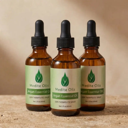 Three bottles of Medité Pure Argan Hair Growth Oil for dry hair, split ends, frizz, and scalp hydration, 90-day supply bundle